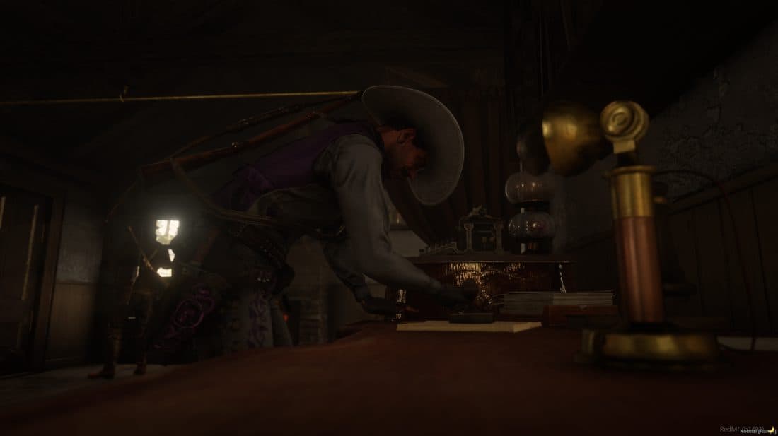 A player working over a safe by lamplight in a dimly lit saloon back room